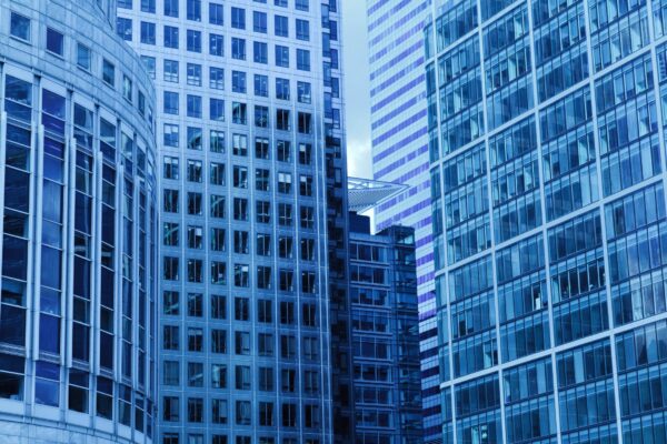 Modern urban office buildings representing professional corporate services